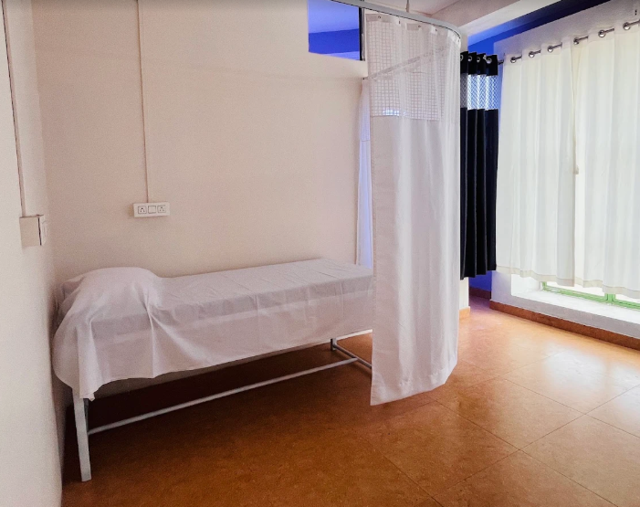 Private physiotherapy treatment room with curtain partition